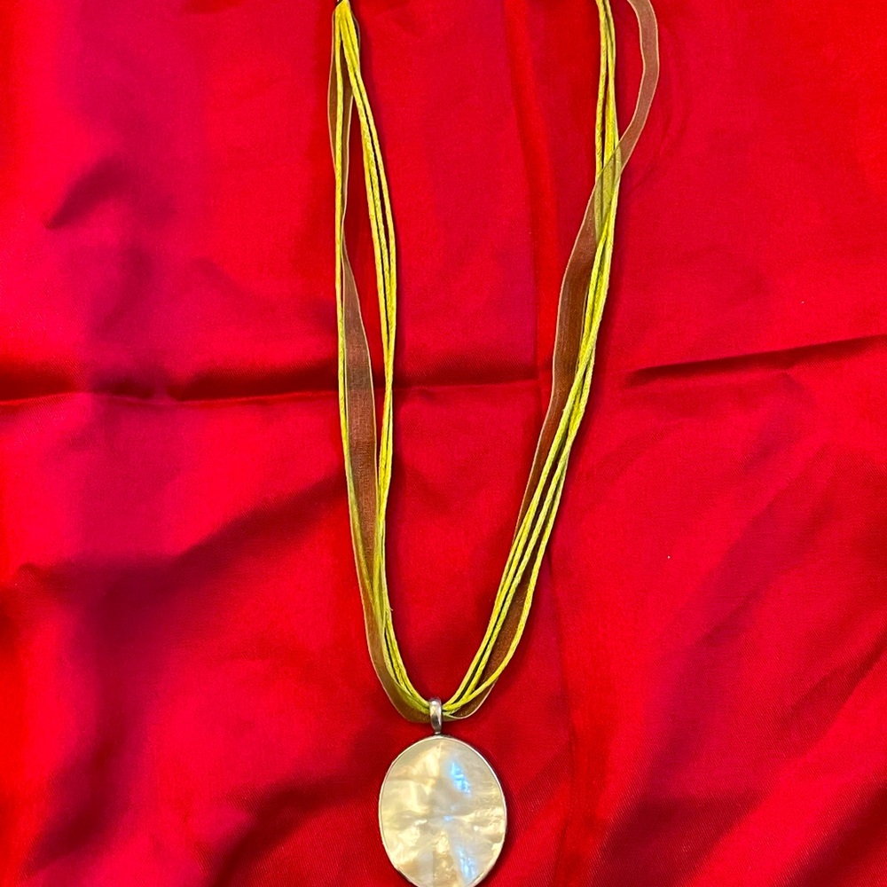 Faux mother of pearl statement necklace on green ribbon